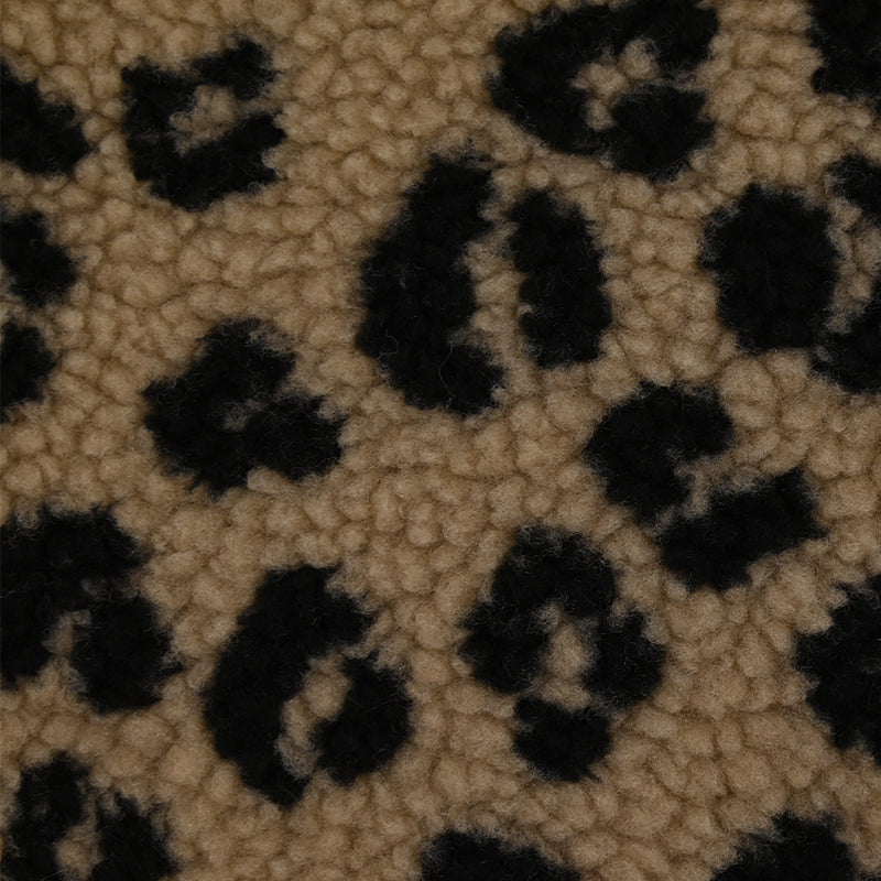 Fausse fourrure sherpa léopard noir fond marron