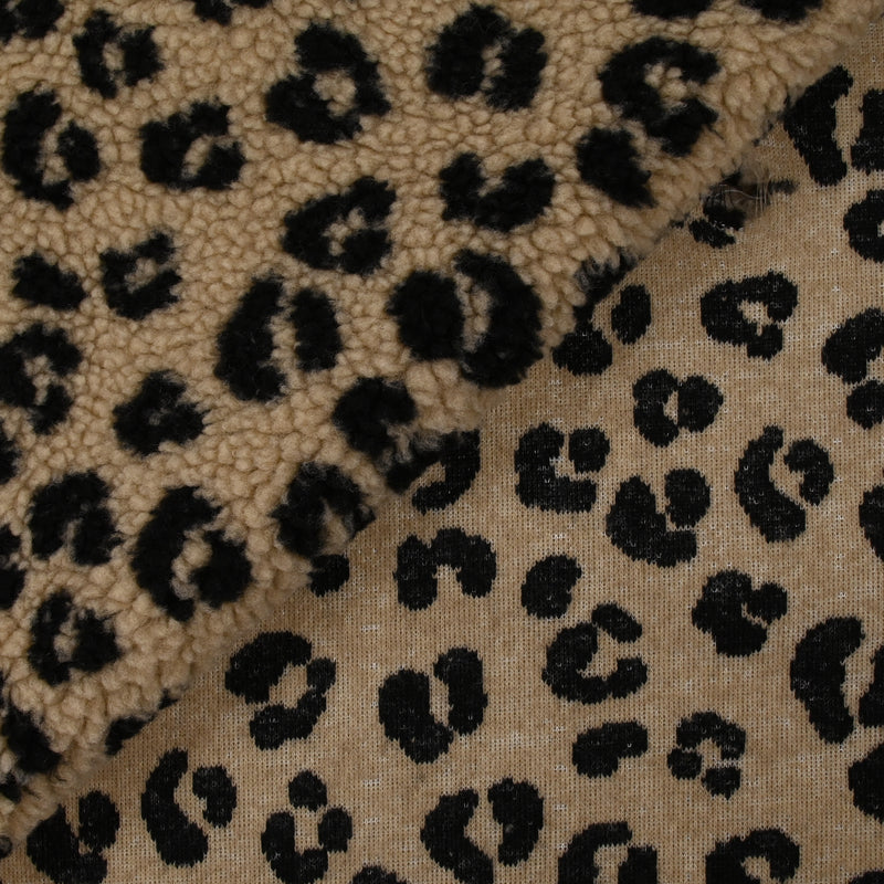 Fausse fourrure sherpa léopard noir fond marron