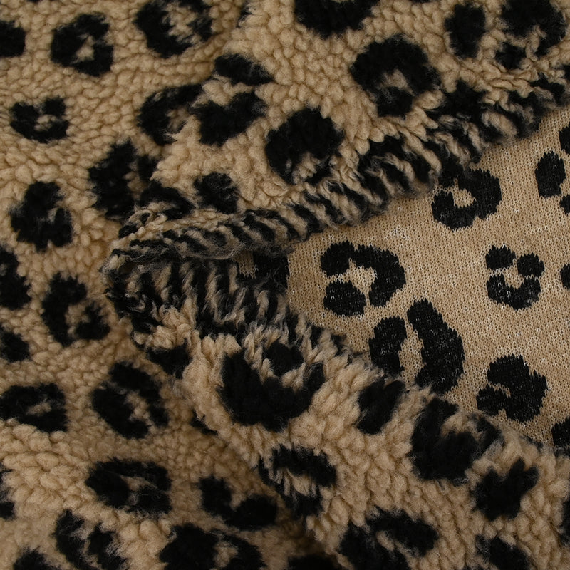 Fausse fourrure sherpa léopard noir fond marron