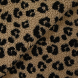 Fausse fourrure sherpa léopard noir fond marron