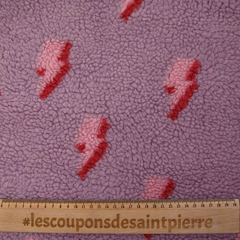 Fausse fourrure sherpa éclairs fond lilas