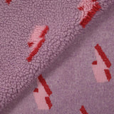 Fausse fourrure sherpa éclairs fond lilas