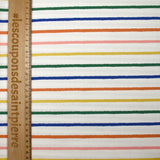 Coton imprimé rayures colorées fond blanc cassé