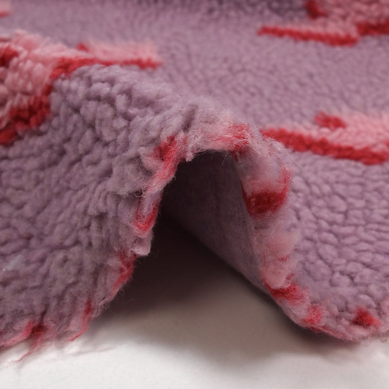 Fausse fourrure sherpa éclairs fond lilas