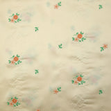 Polyester satin embroidered peach flowers ivory background