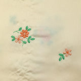 Polyester satin embroidered peach flowers ivory background
