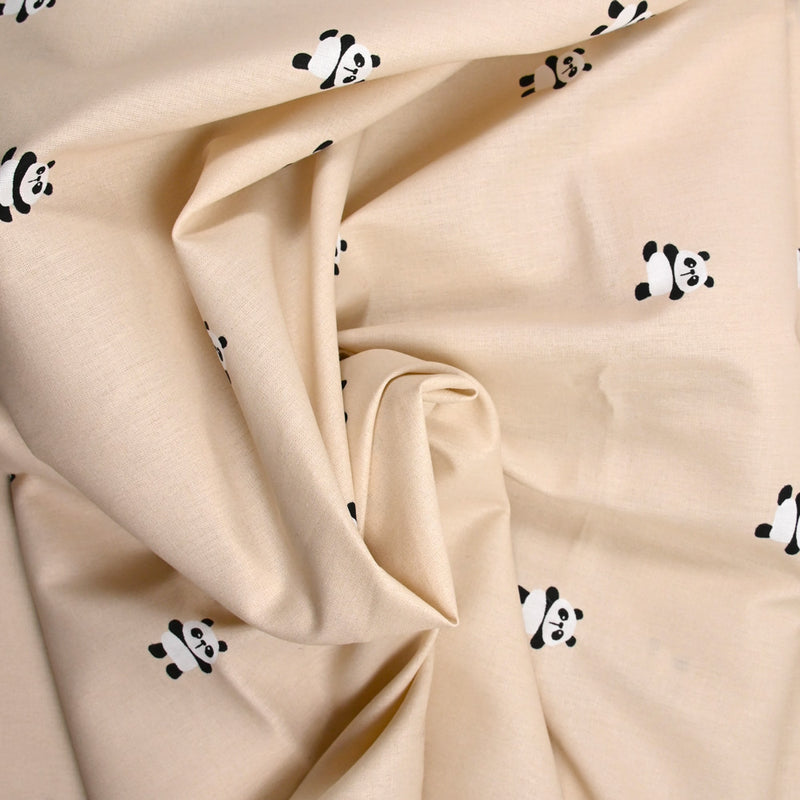 Coton imprimé panda fond sable rosé