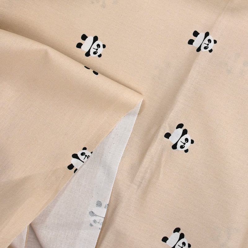 Coton imprimé panda fond sable rosé