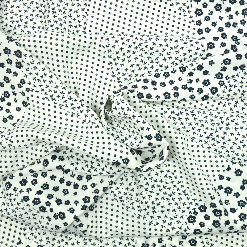 Microfibre imprimée polyester Anoukis marine fond blanc