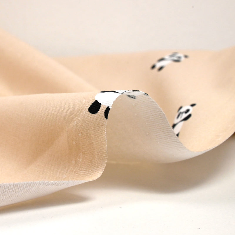 Coton imprimé panda fond sable rosé