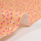 Cotton printed mini flowers salmon background
