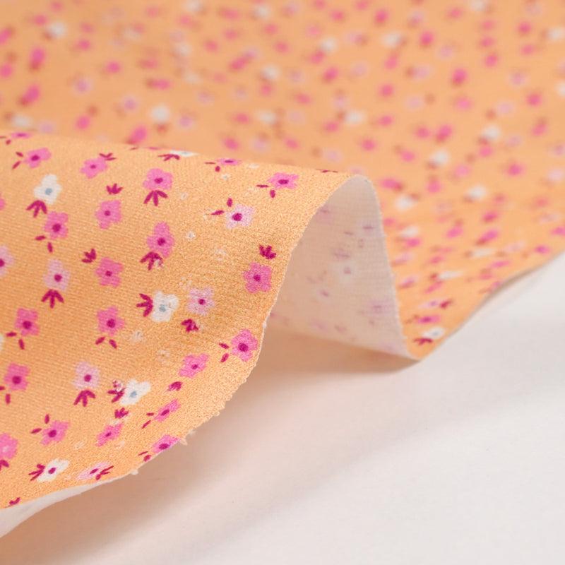 Cotton printed mini flowers salmon background