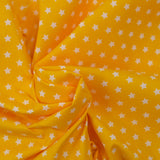 Algodón estampado estrellas 1cm amarillo