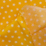 Algodón estampado estrellas 1cm amarillo
