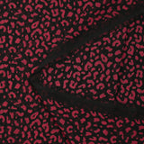 Mousseline imprimée léopard framboise fond noir