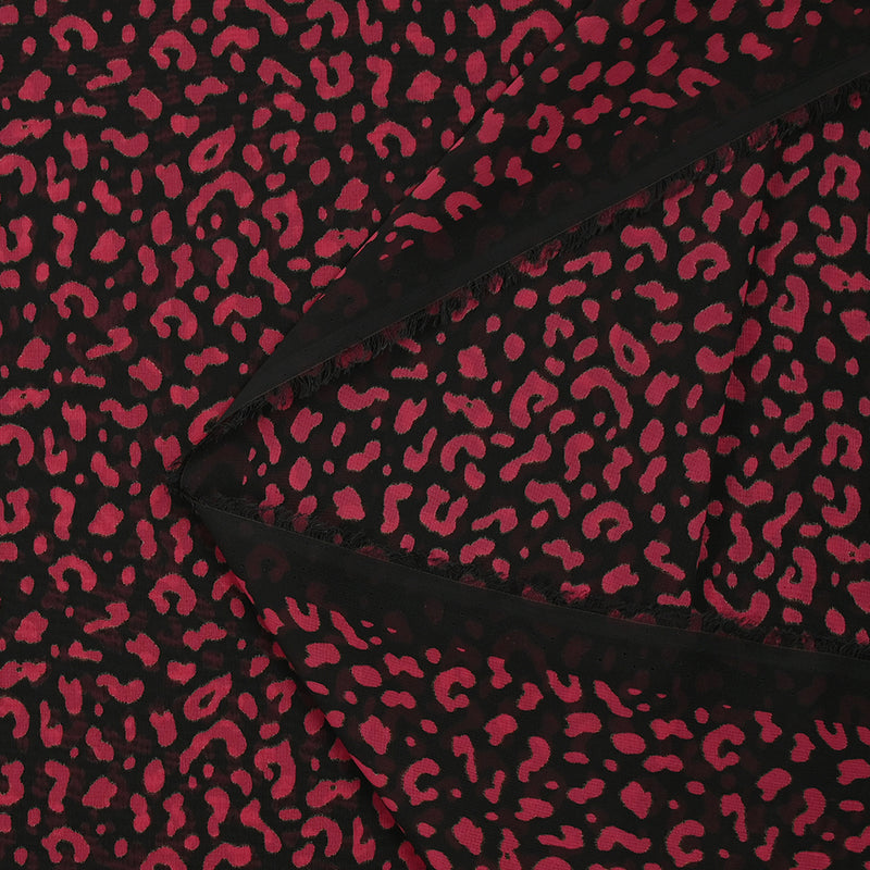 Mousseline imprimée léopard framboise fond noir