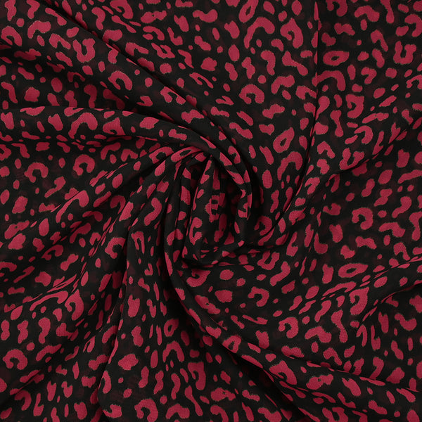 Mousseline imprimée léopard framboise fond noir
