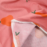 Velours de coton côtelé imprimé poire orange fond rose