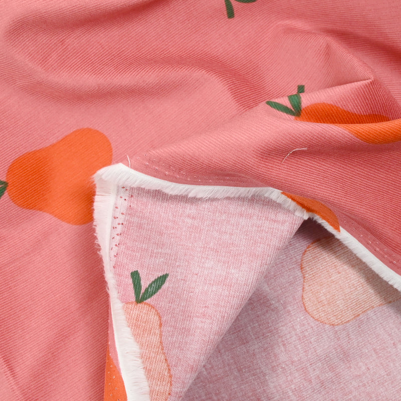 Velours de coton côtelé imprimé poire orange fond rose