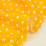 Algodón estampado estrellas 1cm amarillo