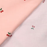 Velours de coton côtelé imprimé cerise fond rose