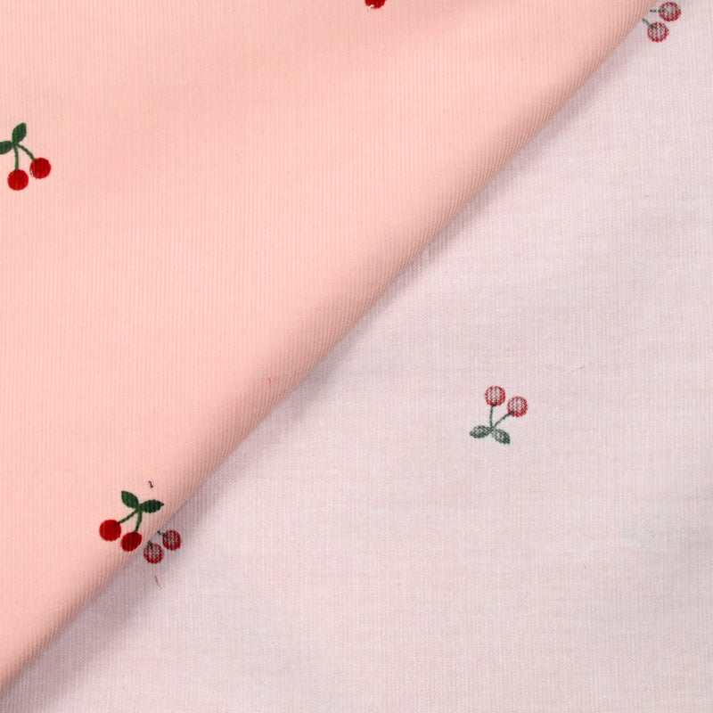 Velours de coton côtelé imprimé cerise fond rose