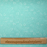 Jacquard nid d'abeille satiné fleurs turquoise et blanc