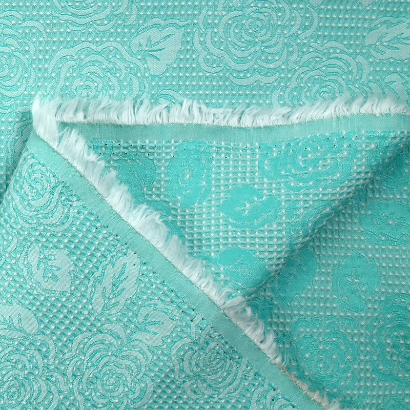 Jacquard nid d'abeille satiné fleurs turquoise et blanc