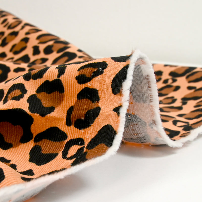 Velours de coton côtelé imprimé léopard fond camel
