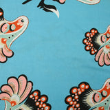 Jersey imprimé envolée fond bleu turquoise