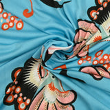 Jersey imprimé envolée fond bleu turquoise