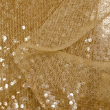 Sequins sur tulle résille ambre