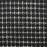 Wool blend tweed with ecru checks on navy and black background