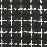 Wool blend tweed with ecru checks on navy and black background