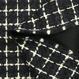 Wool blend tweed with ecru checks on navy and black background