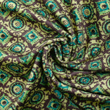 Velours ras imprimé abstrait gris et turquoise fond vert clair