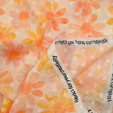 100% cotton veil Plumetis daisy print orange and pink ecru background