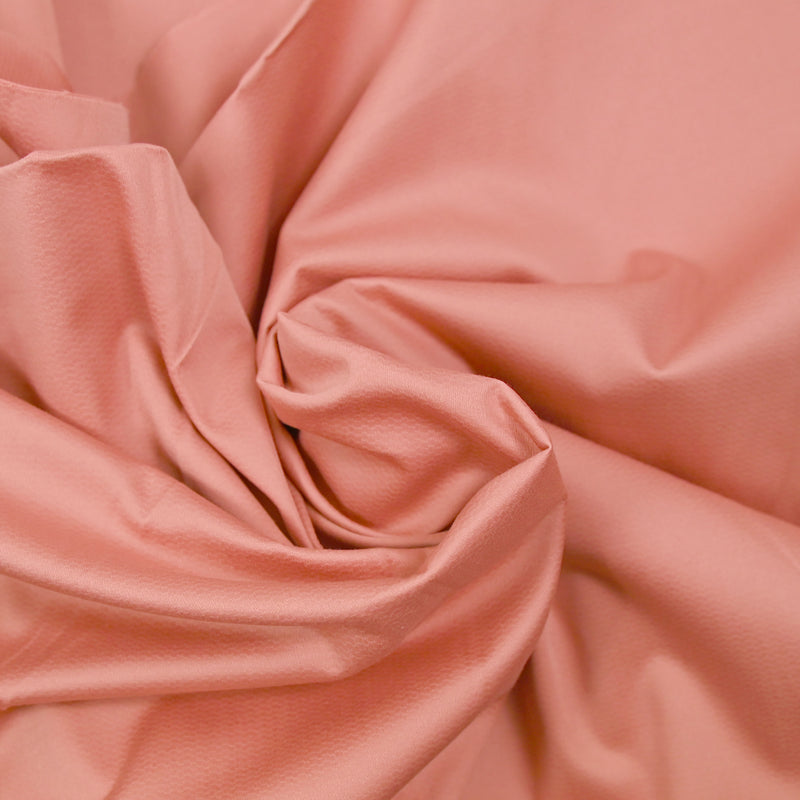 Satin de coton élasthanne fantaisie rose saumon