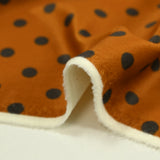 Velours ras imprimé pois fond orange brûlé