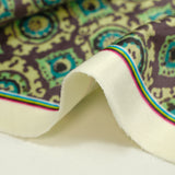 Velours ras imprimé abstrait gris et turquoise fond vert clair