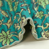 Velours matelassé double face block print et abstrait turquoise au mètre