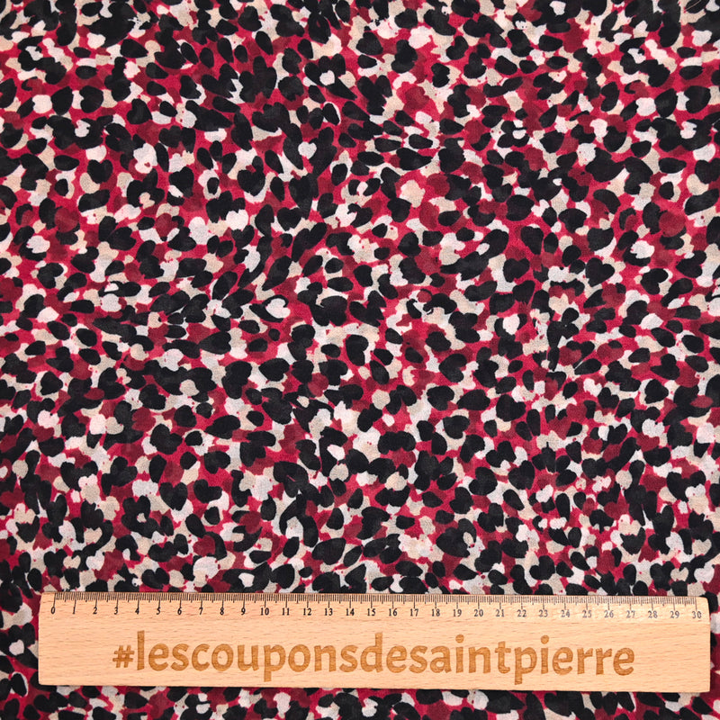 Mousseline de polyester imprimée confettis fond bordeaux