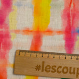Viscose linen printed with rainbow grid on ecru background