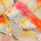 Viscose linen printed with rainbow grid on ecru background