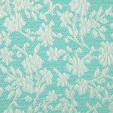 Jacquard de polycoton liaison de fleurs fond turquoise