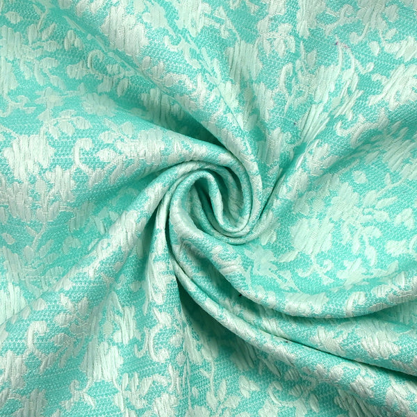 Jacquard de polycoton liaison de fleurs fond turquoise