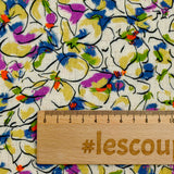 Lin viscose imprimé fleurs de pensées violet et vert fond écru