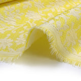 Jacquard de polycoton liaison de fleurs fond jaune