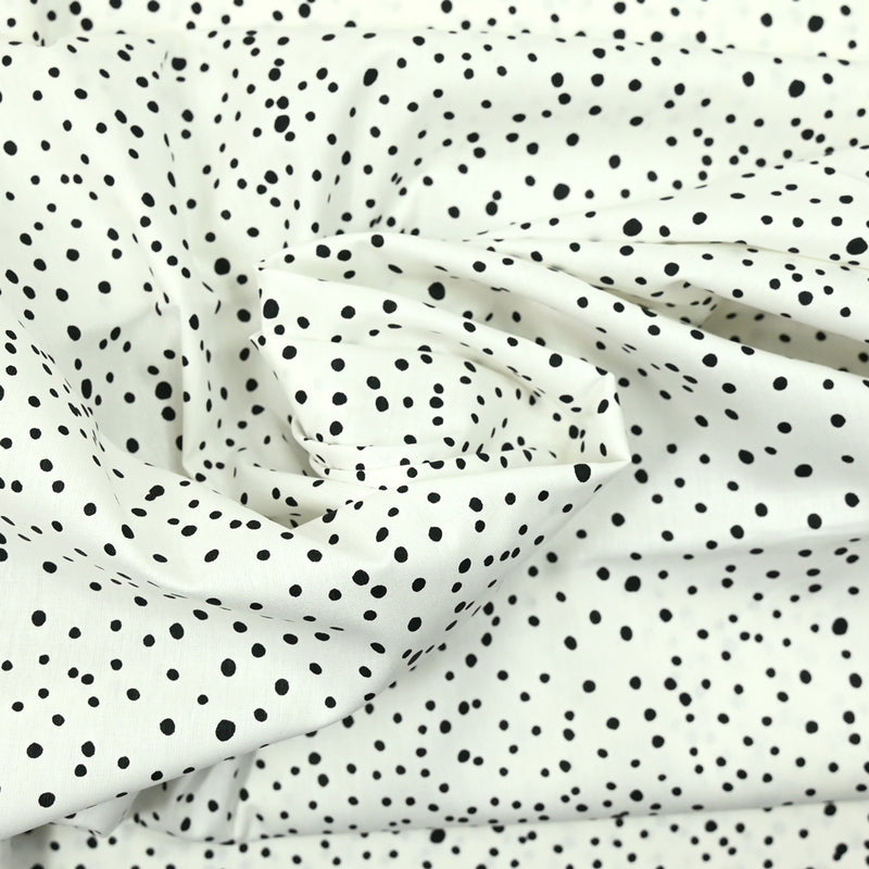 Popeline de coton imprimée confettis fond blanc