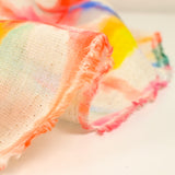 Viscose linen printed with rainbow grid on ecru background